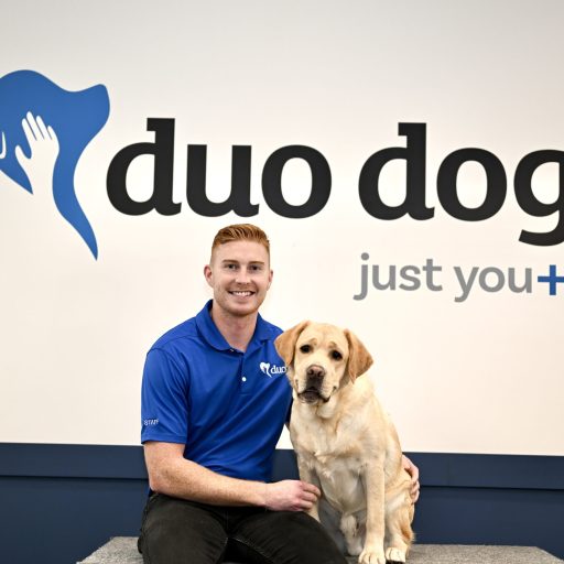 Tony sitting next to Duo Dog Woody